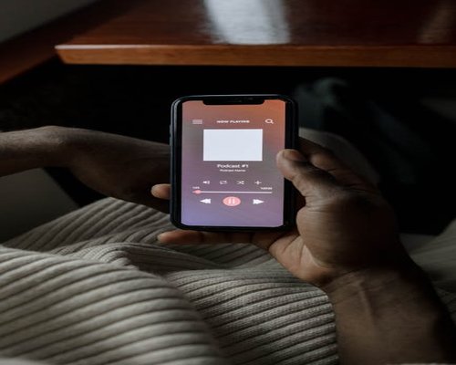 Person listening to podcast on a bus instead of looking at phone