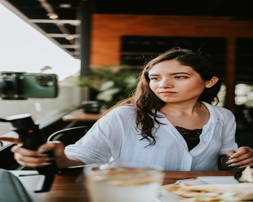 Portrait of the content creator in a local cafe